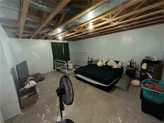 bedroom featuring concrete floors