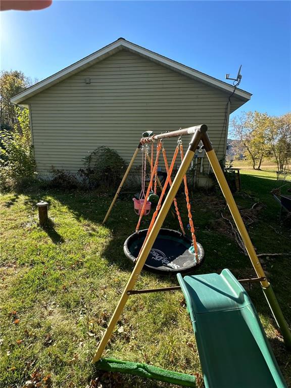 view of playground with a yard