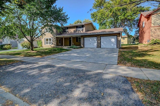 view of front facade featuring a garage and a front lawn