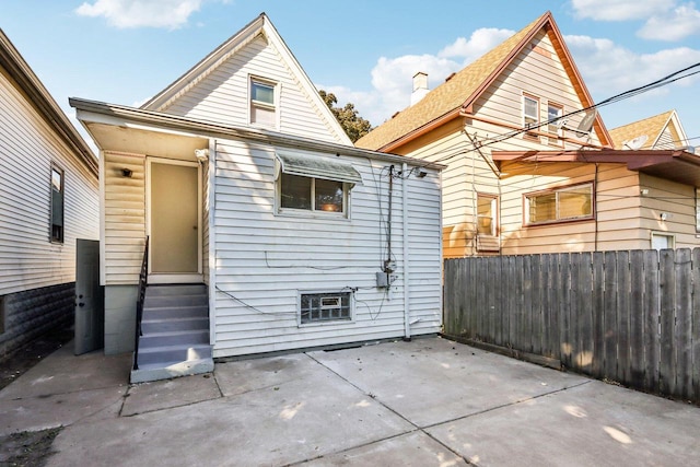 rear view of property featuring a patio