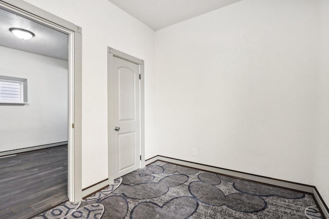 empty room featuring dark hardwood / wood-style floors