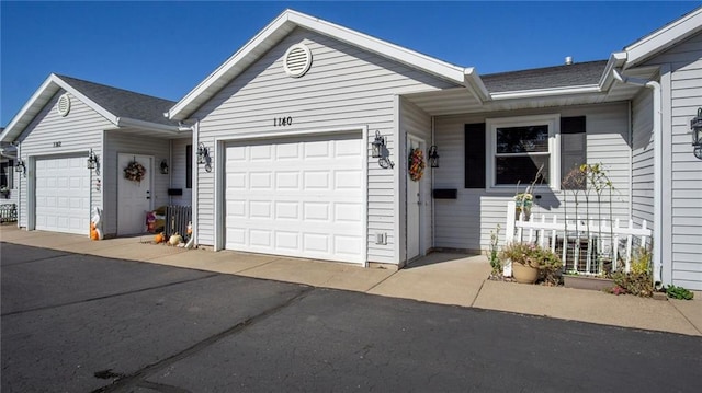 single story home with a garage