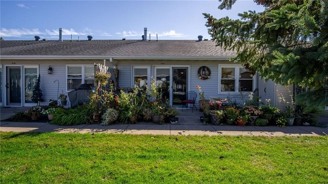 single story home featuring a front yard and a patio