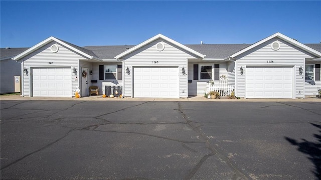 single story home featuring a garage