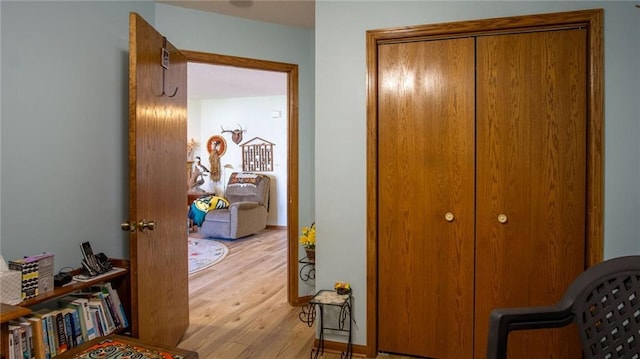 corridor featuring light hardwood / wood-style flooring