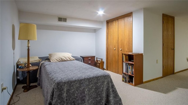 carpeted bedroom featuring a closet