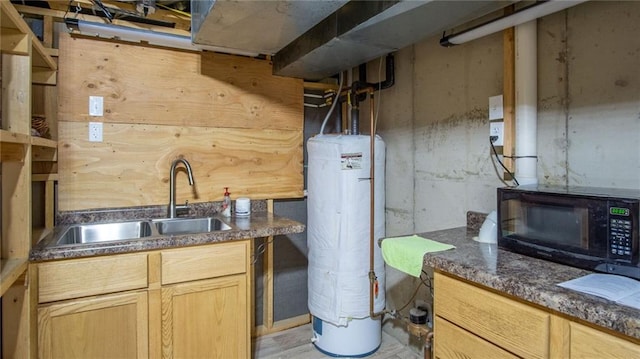 kitchen with light brown cabinets, gas water heater, and sink