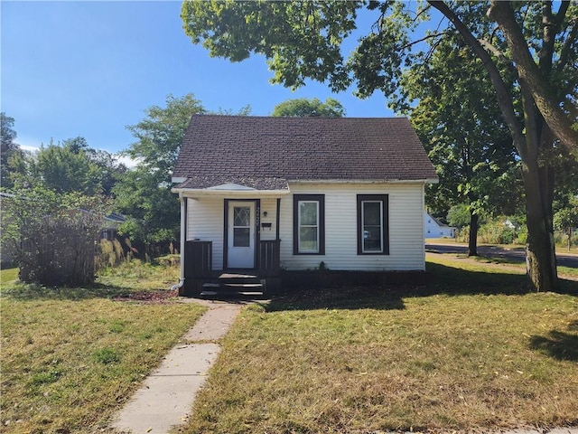 bungalow-style house with a front yard