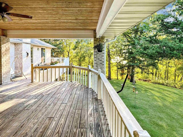 63574 Lohmann Ln, Eastman, WI 52626 - wooden terrace featuring a yard and ceiling fan