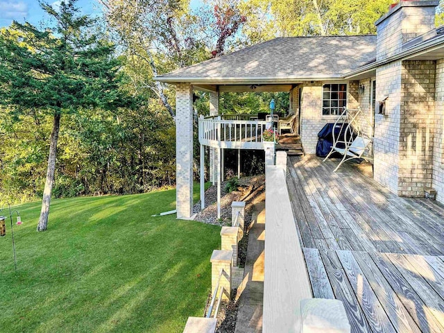 63574 Lohmann Ln, Eastman, WI 52626 - wooden deck featuring a yard