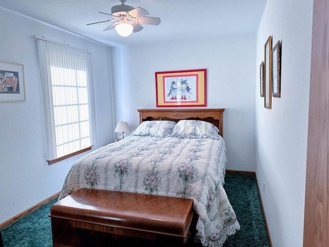 63574 Lohmann Ln, Eastman, WI 52626 - carpeted bedroom with ceiling fan and baseboards