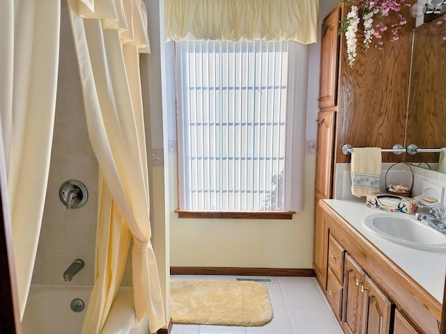 63574 Lohmann Ln, Eastman, WI 52626 - bathroom with tile patterned flooring, healthy amount of natural light, vanity, and shower / bathtub combination with curtain