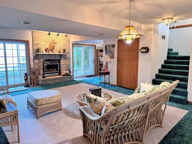 63574 Lohmann Ln, Eastman, WI 52626 - living area featuring carpet, healthy amount of natural light, a brick fireplace, and stairway