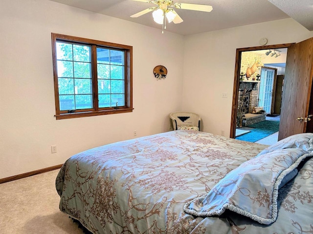 63574 Lohmann Ln, Eastman, WI 52626 - carpeted bedroom with baseboards and a ceiling fan