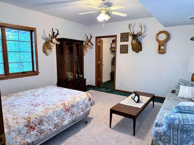 63574 Lohmann Ln, Eastman, WI 52626 - bedroom featuring carpet, ceiling fan, and a spacious closet