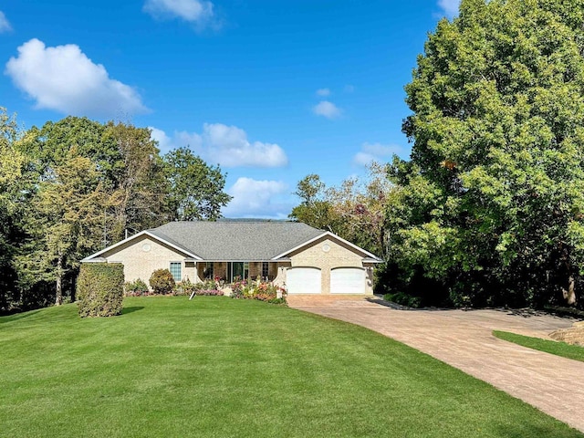 63574 Lohmann Ln, Eastman, WI 52626 - ranch-style home with an attached garage, concrete driveway, and a front yard