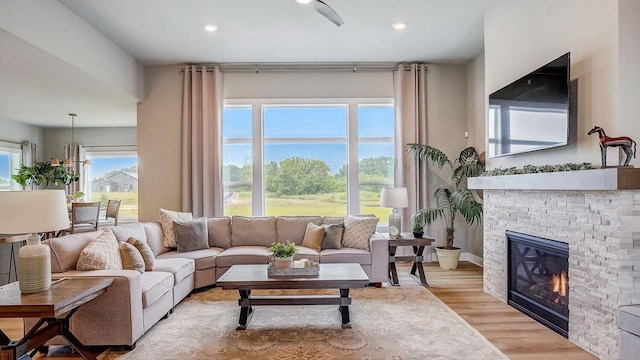 living room featuring a fireplace and light hardwood / wood-style floors