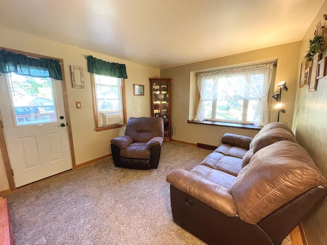 living room featuring cooling unit, plenty of natural light, and carpet flooring