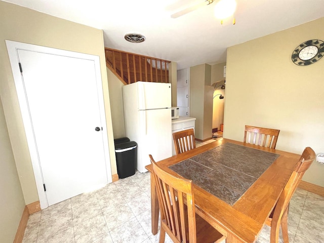 dining room featuring ceiling fan