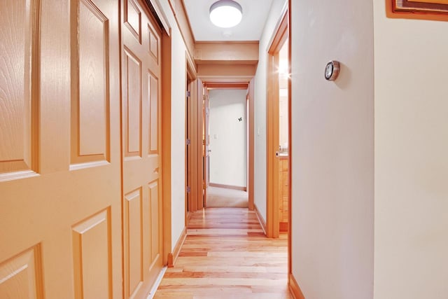 hall with light hardwood / wood-style flooring