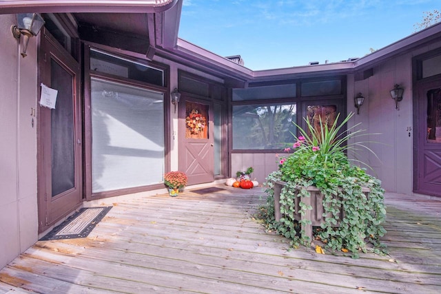 property entrance with a wooden deck