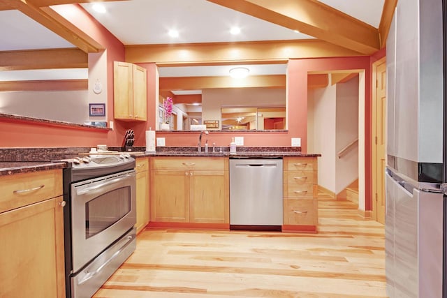 kitchen with light brown cabinetry, light hardwood / wood-style floors, sink, and stainless steel appliances