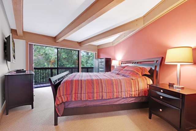 bedroom featuring a skylight, light carpet, and beam ceiling