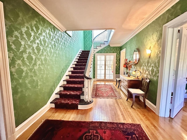 interior space with crown molding and wood-type flooring