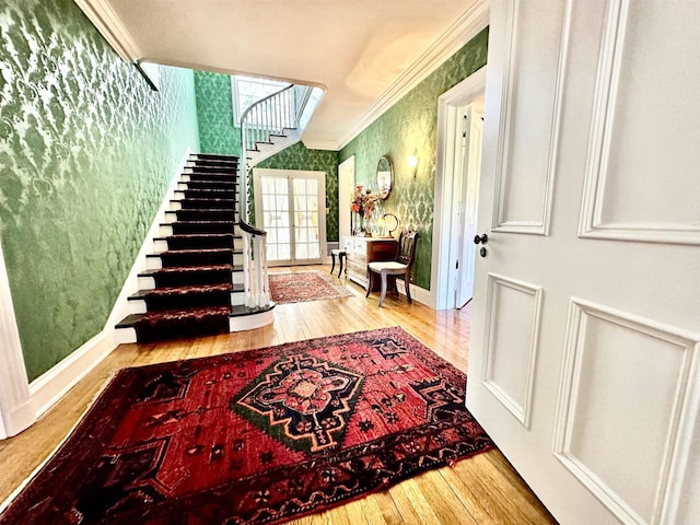 interior space featuring crown molding and light wood-type flooring