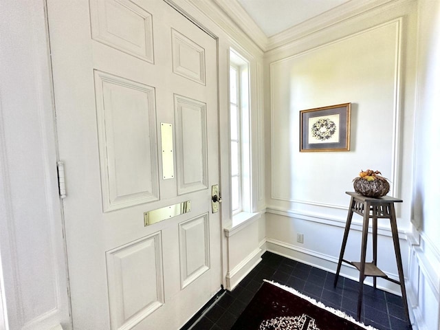 tiled foyer with ornamental molding