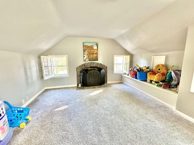 playroom featuring plenty of natural light, lofted ceiling, and carpet floors