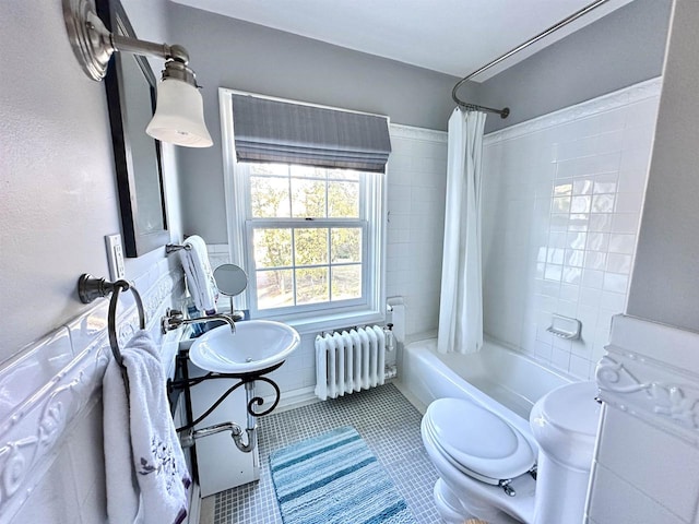 full bathroom with tile patterned flooring, toilet, radiator, and shower / tub combo with curtain