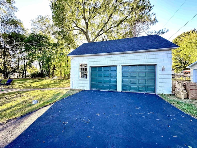 garage with a lawn