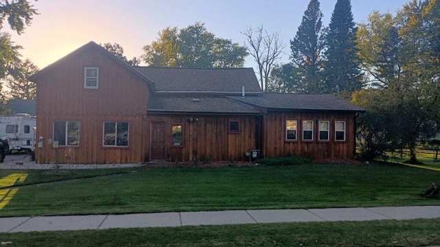 view of front of property with a yard