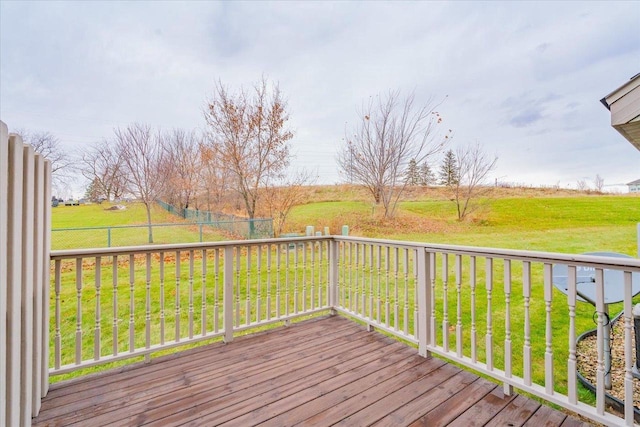 deck featuring a yard and a rural view