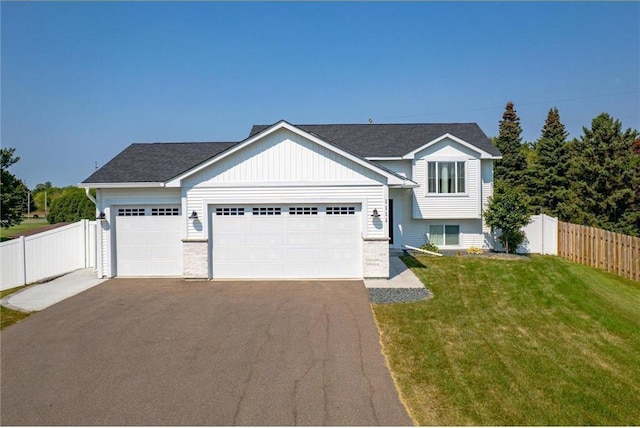 view of front of home with a garage and a front yard