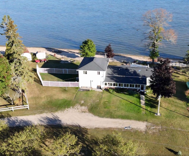 birds eye view of property with a water view