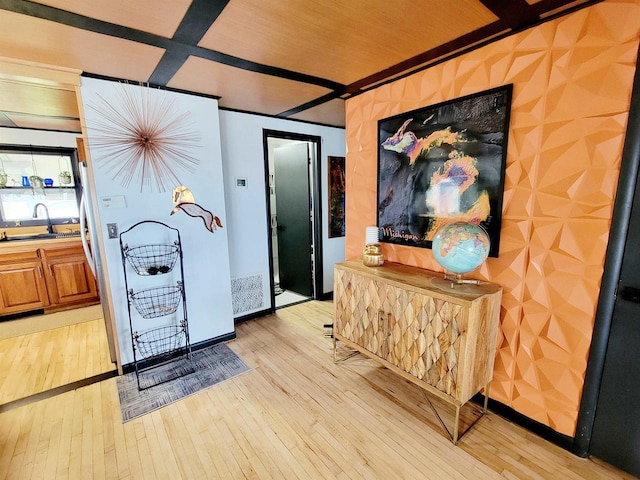 interior space with sink and light wood-type flooring