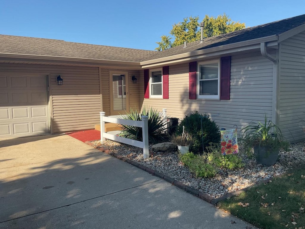 property entrance featuring a garage