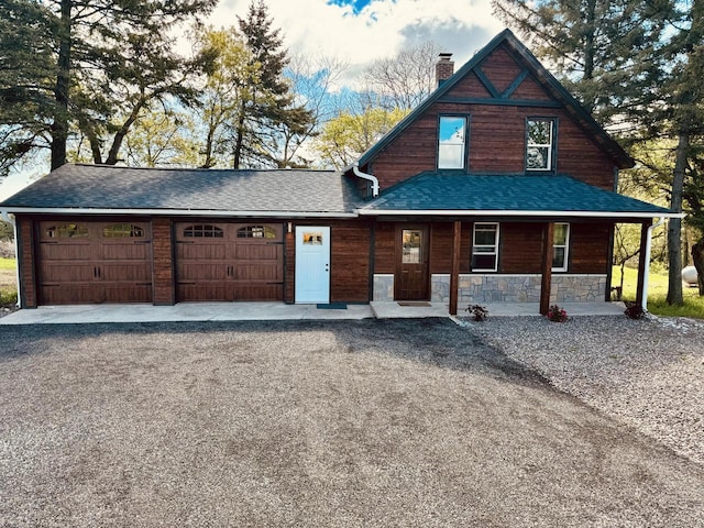 view of front of property with a garage and a porch