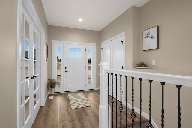 W4946 Battlestone Station Rd Unit 23, La Crosse, WI 54601 - entryway with french doors, baseboards, and wood finished floors