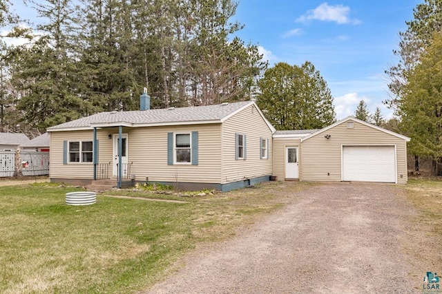 ranch-style home with a front lawn and a garage