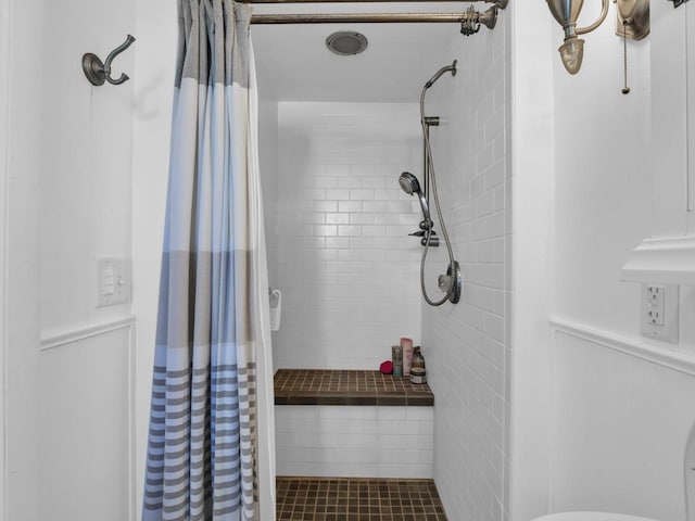 bathroom featuring walk in shower and tile patterned floors