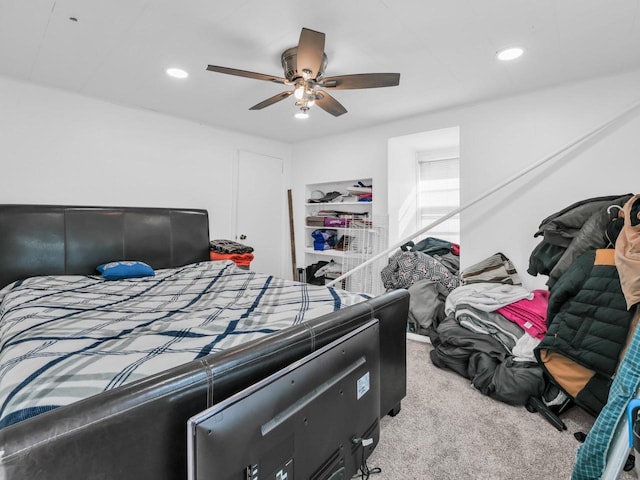 bedroom with light colored carpet and ceiling fan