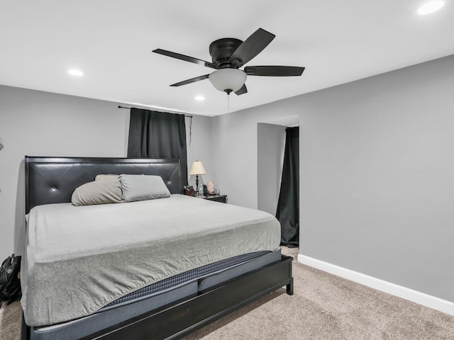 bedroom with ceiling fan and carpet floors