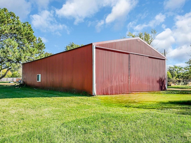 view of outdoor structure with a lawn