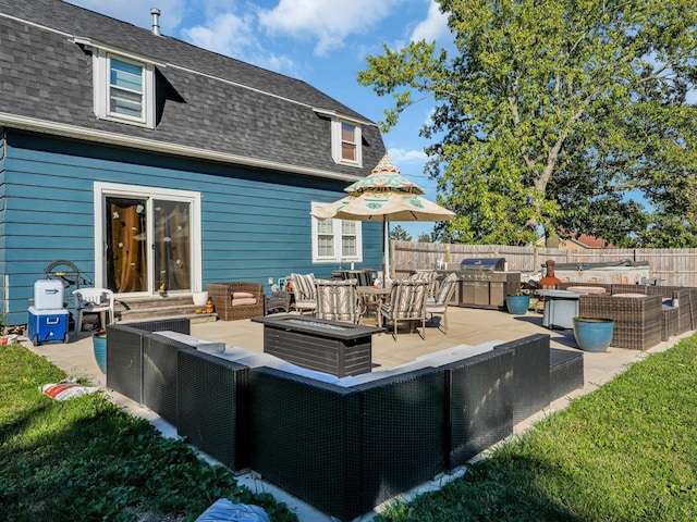 exterior space with an outdoor living space with a fire pit, a yard, and a patio area