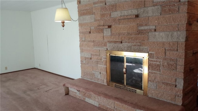 interior details with a stone fireplace and carpet flooring