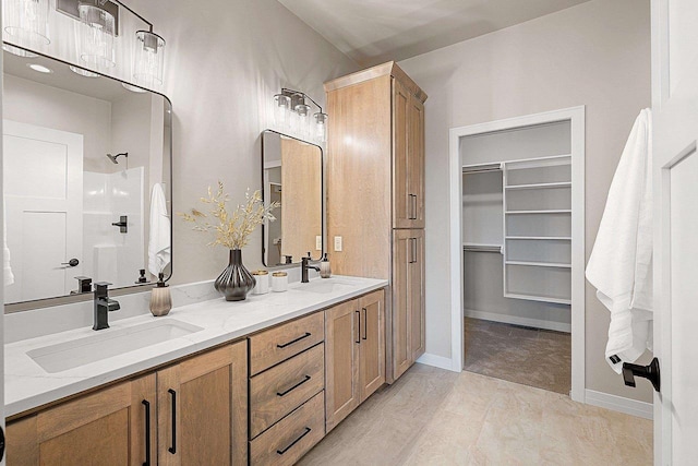 bathroom with a shower and vanity