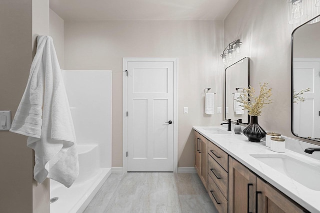 bathroom featuring vanity and wood-type flooring